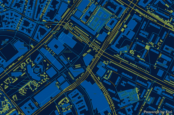 Digitale Stadtkarte mit Gebäuden, Straßen und Baumbestand, dargestellt als GIS-Grundkarte in Blau- und Gelbtönen.